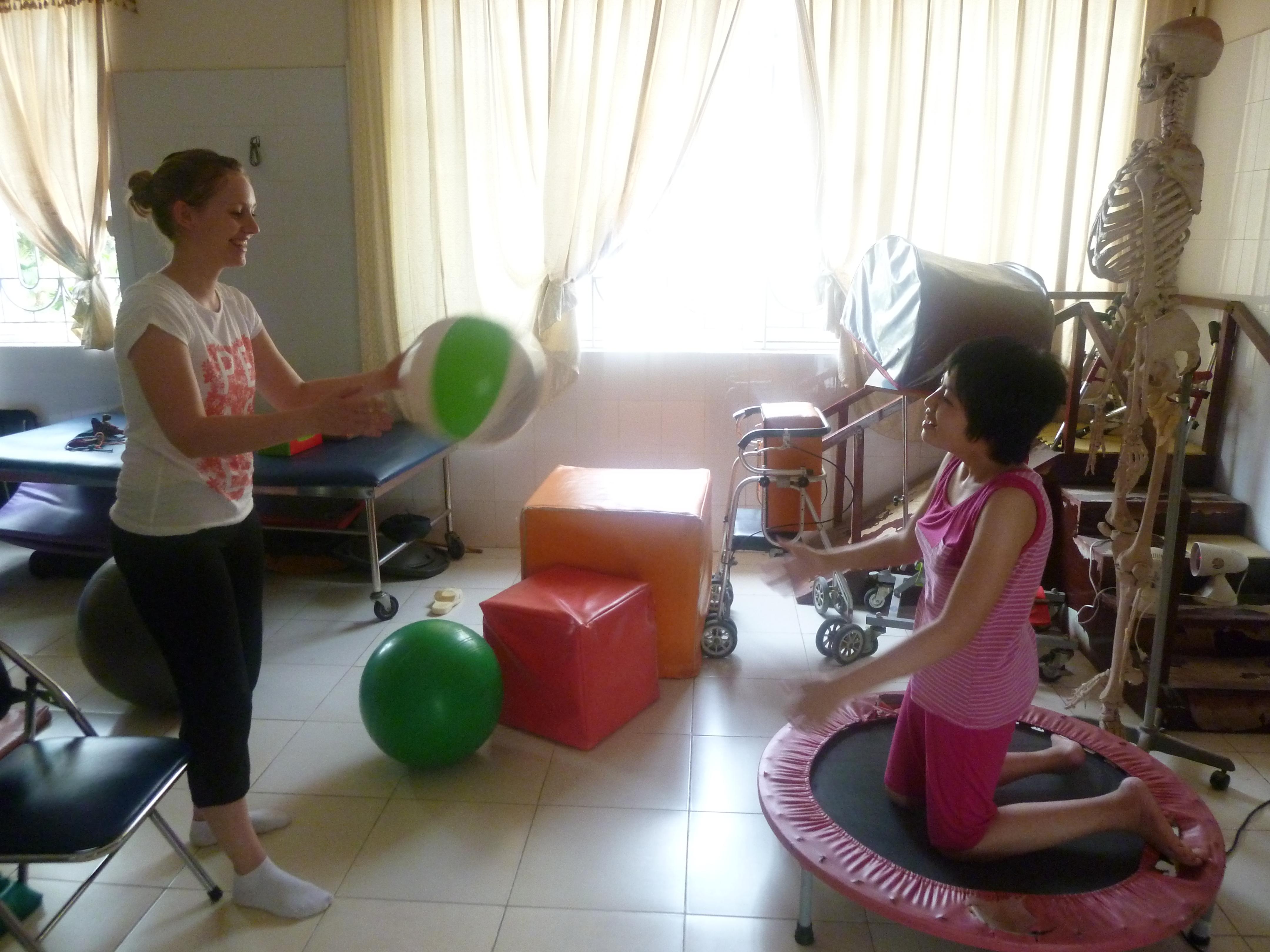 Physiotherapy intern gaining work experience and participating in sensory play as part of her physiotherapy internship in Vietnam with Proejcts Abroad. Female intern with Projects Abroad participating in sensory play with a child during her physiotherapy internship in Vietnam.